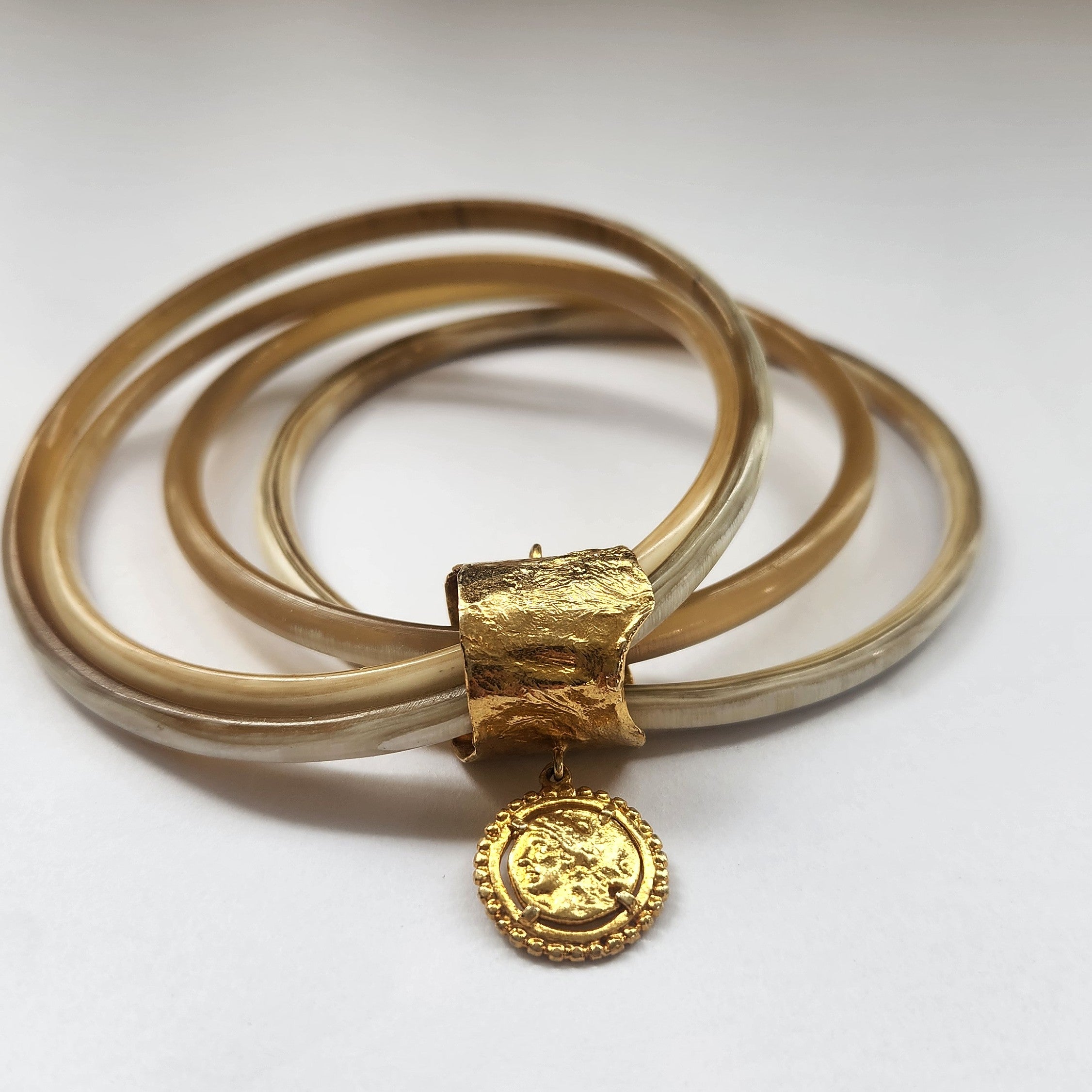 Natural buffalo bangle cluster with gold plated detail