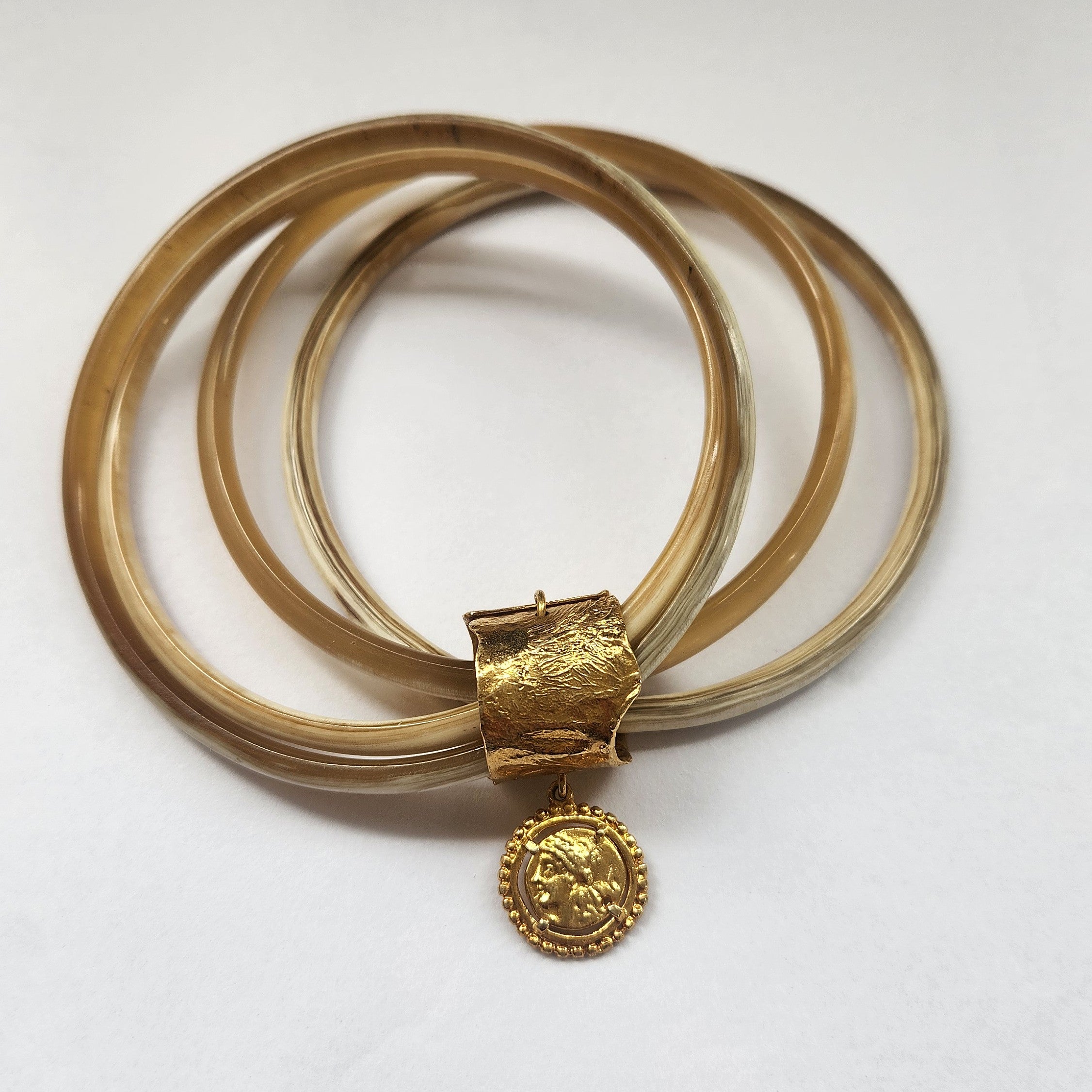 Natural buffalo bangle cluster with gold plated detail