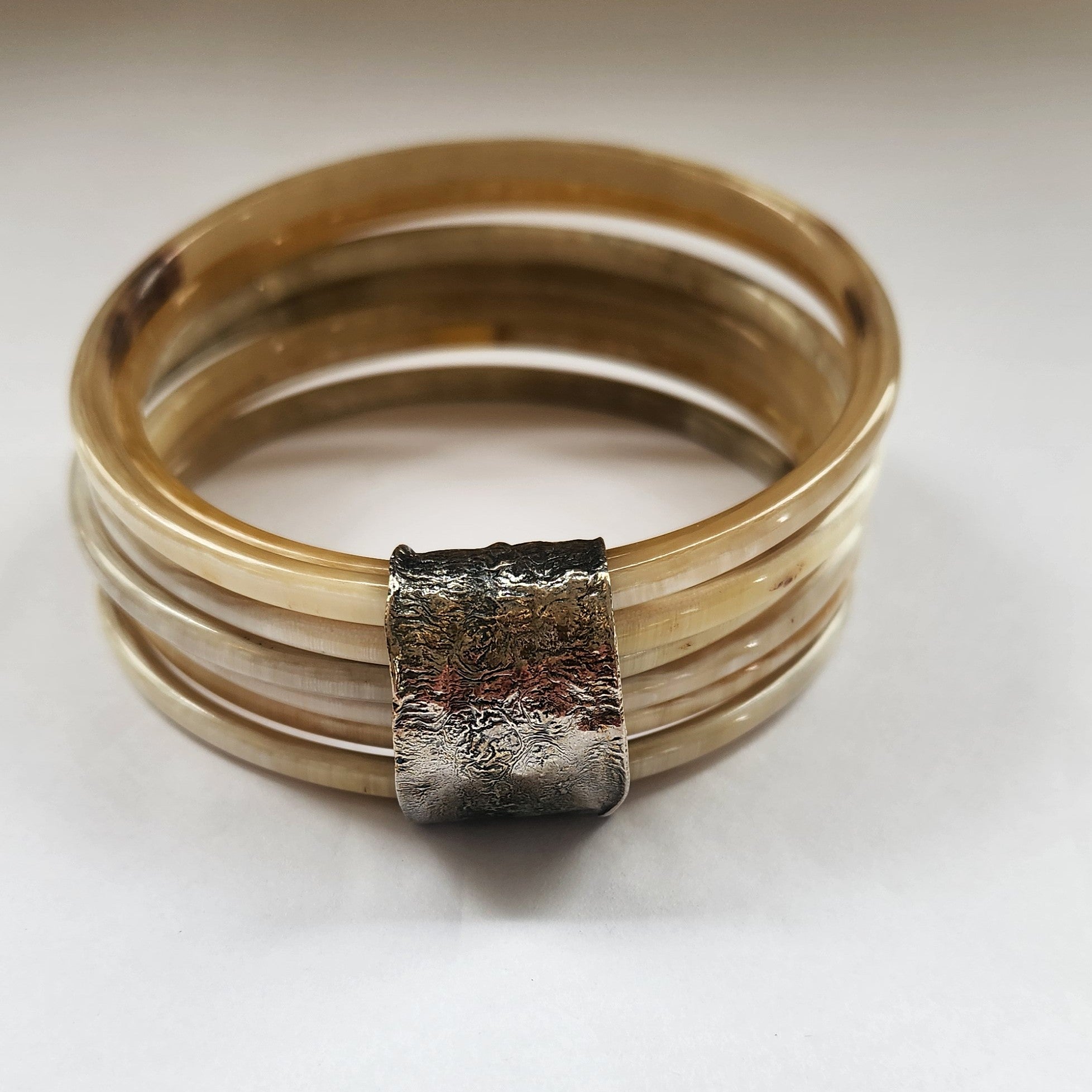 Natural buffalo bangle cluster with silver plated detail