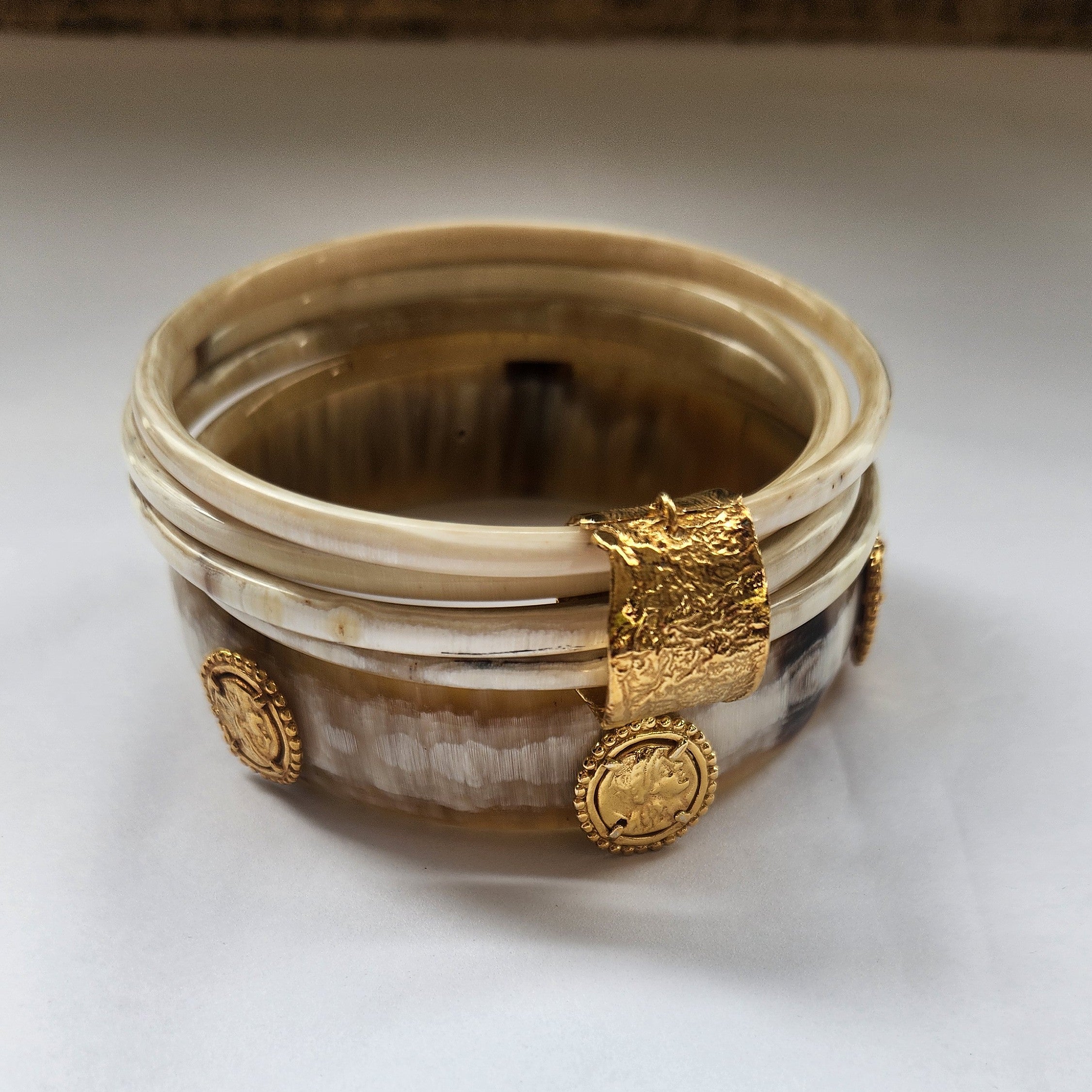 Natural buffalo bangle cluster with gold plated detail