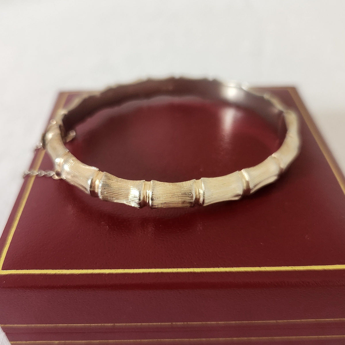 gilded sterling silver bangle on red box