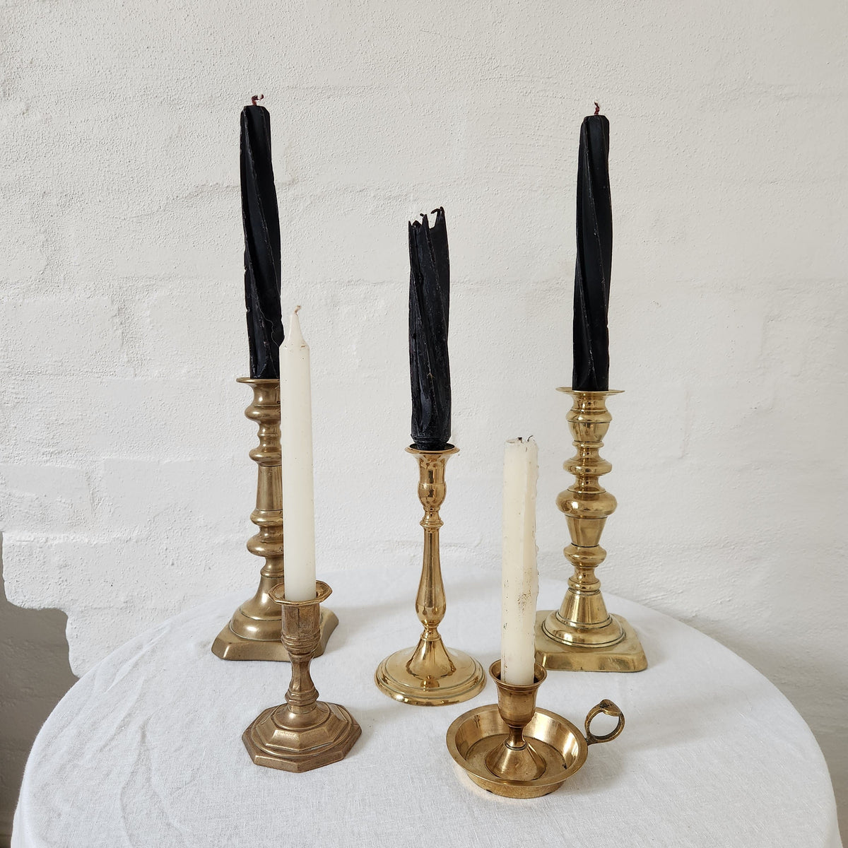 Group of Antique Brass Candle holders with candles