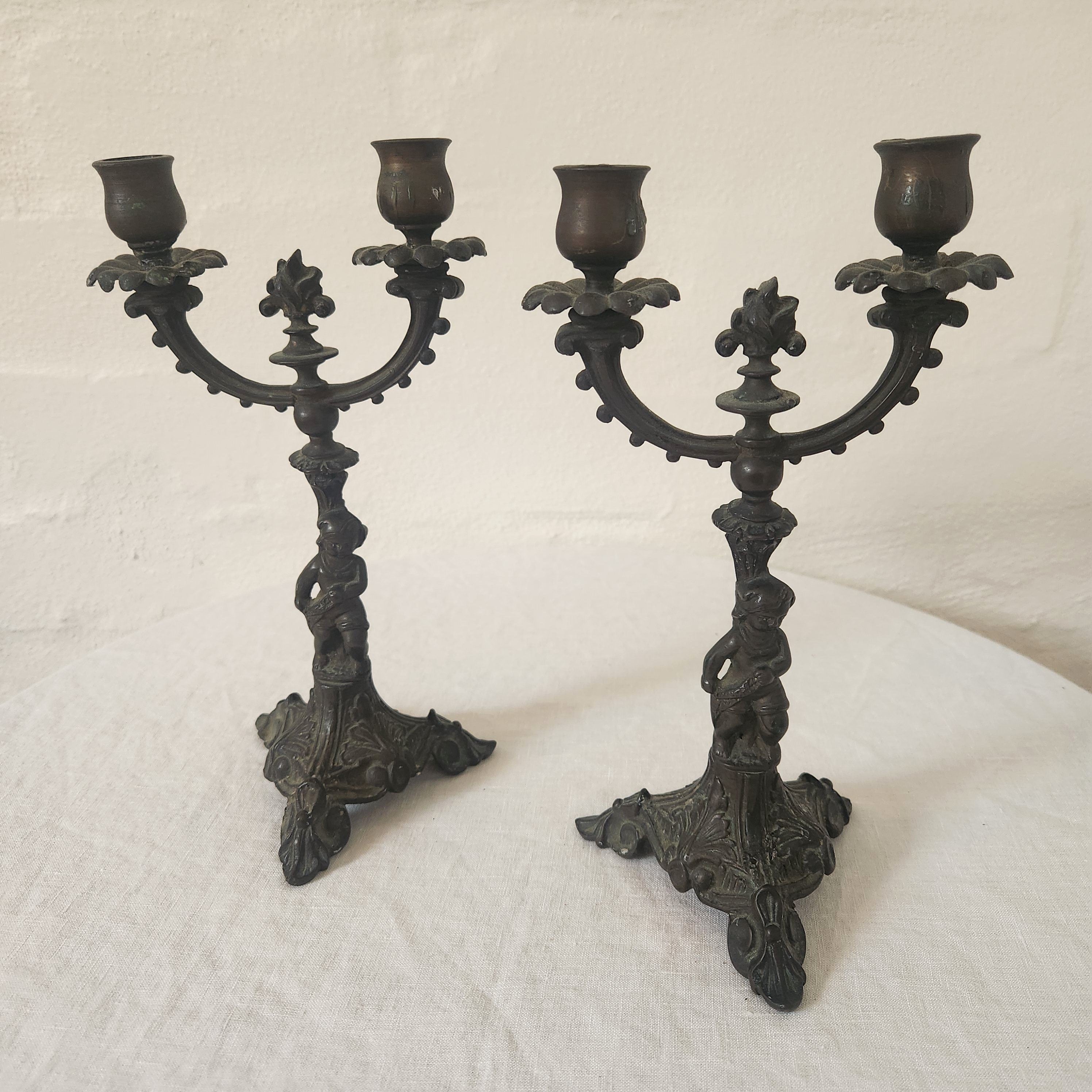 Pair of Cast Iron Metal Putto Candelabras
