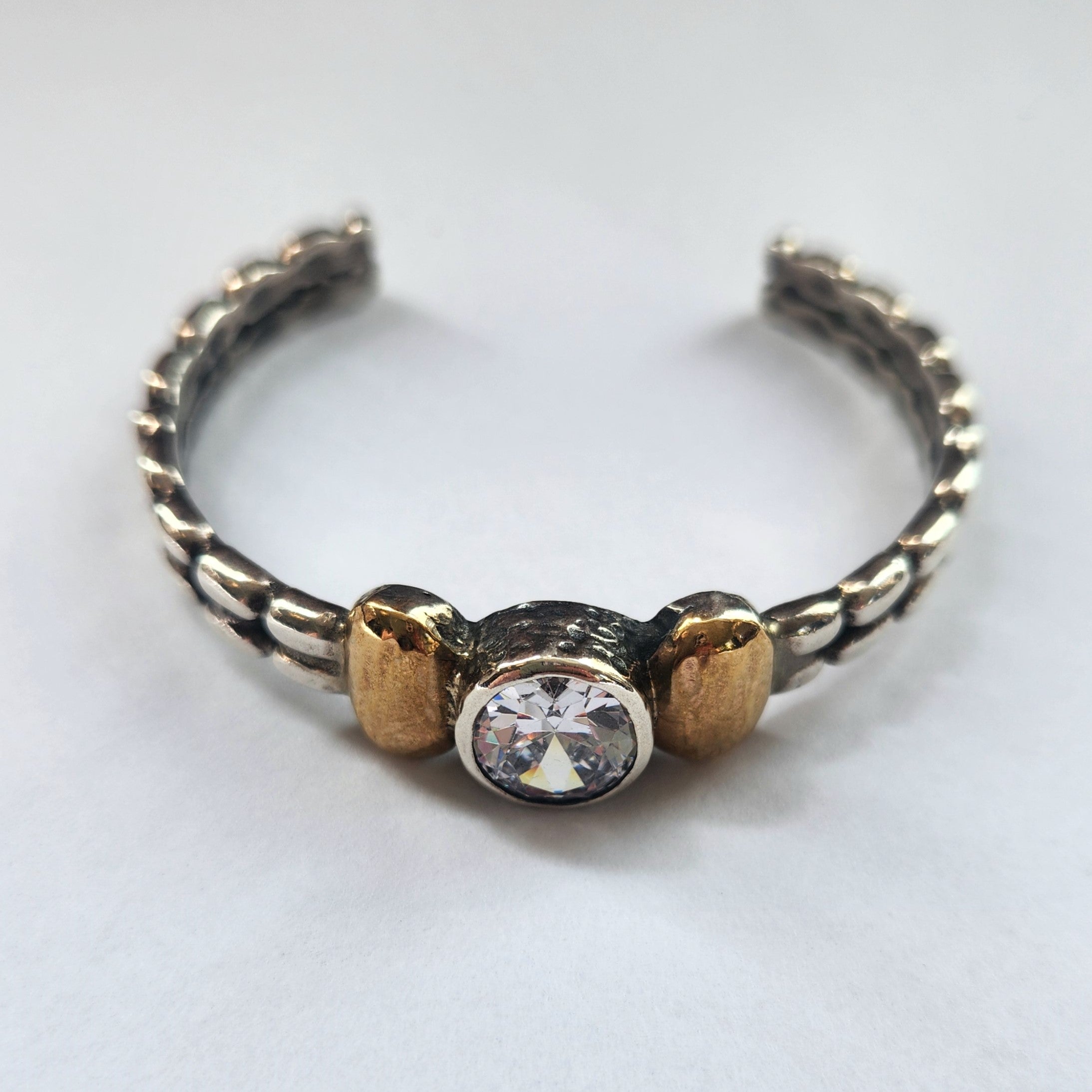 "Celeste" Sterling Silver Cuff with 9 ct gold and Zirconia Centre Stone.