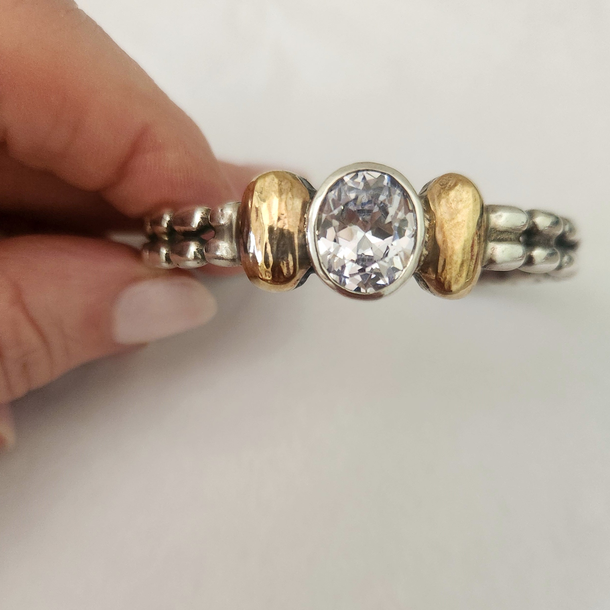"Celeste" Sterling Silver Cuff with 9 ct gold and Zirconia Centre Stone.