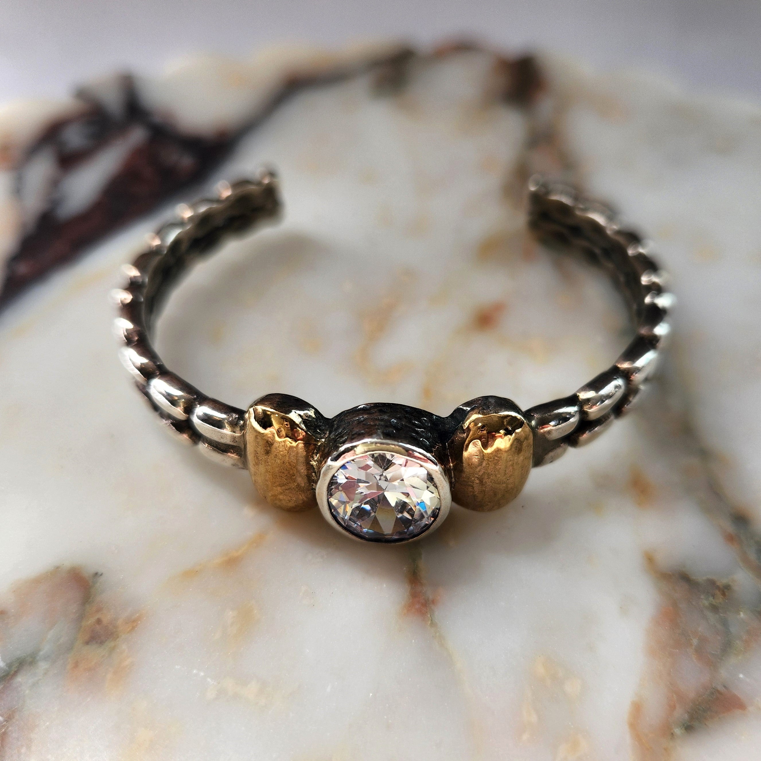 "Celeste" Sterling Silver Cuff with 9 ct gold and Zirconia Centre Stone.