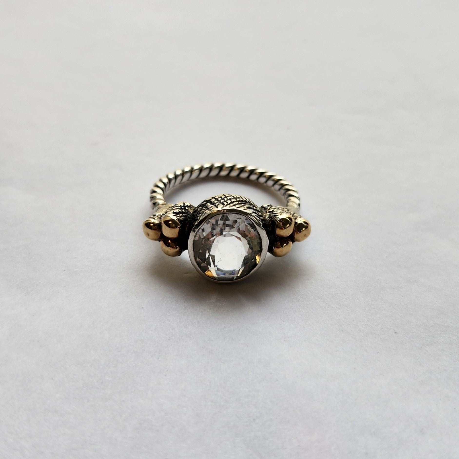 "Luciana" Plaited Silver Ring with Centre rock crystal and 9ct gold clusters.