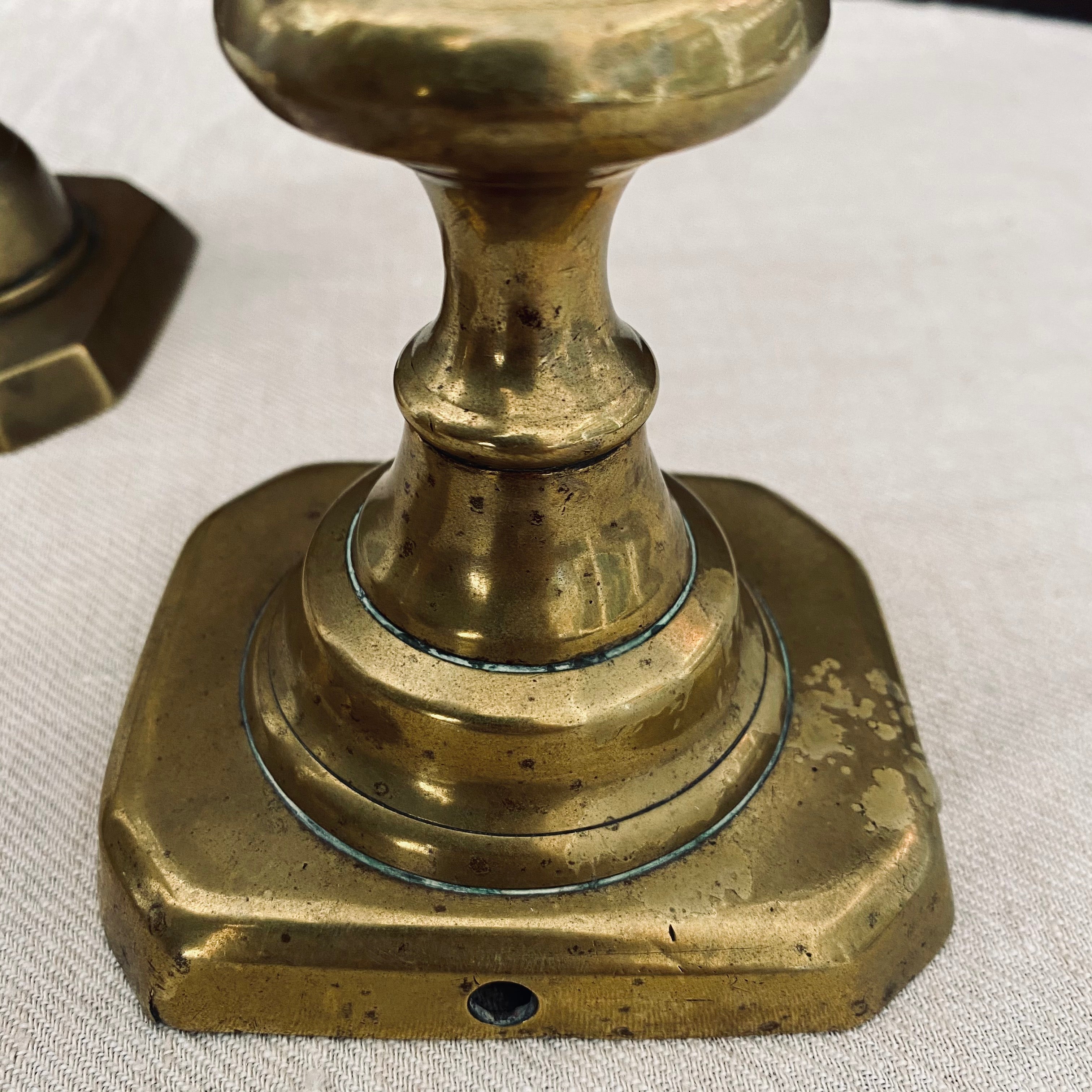 Trio of Antique Brass Candlesticks