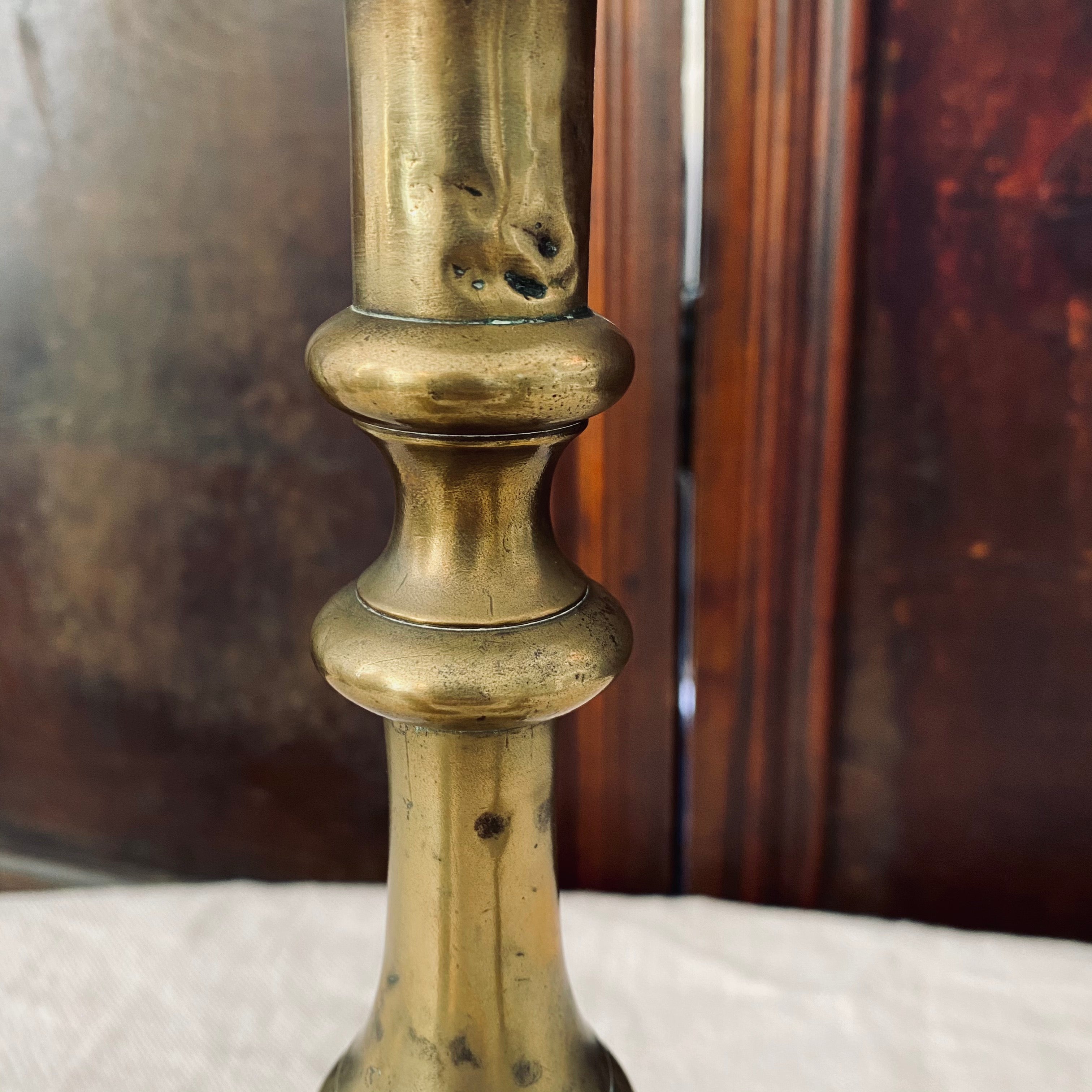 Trio of Antique Brass Candlesticks