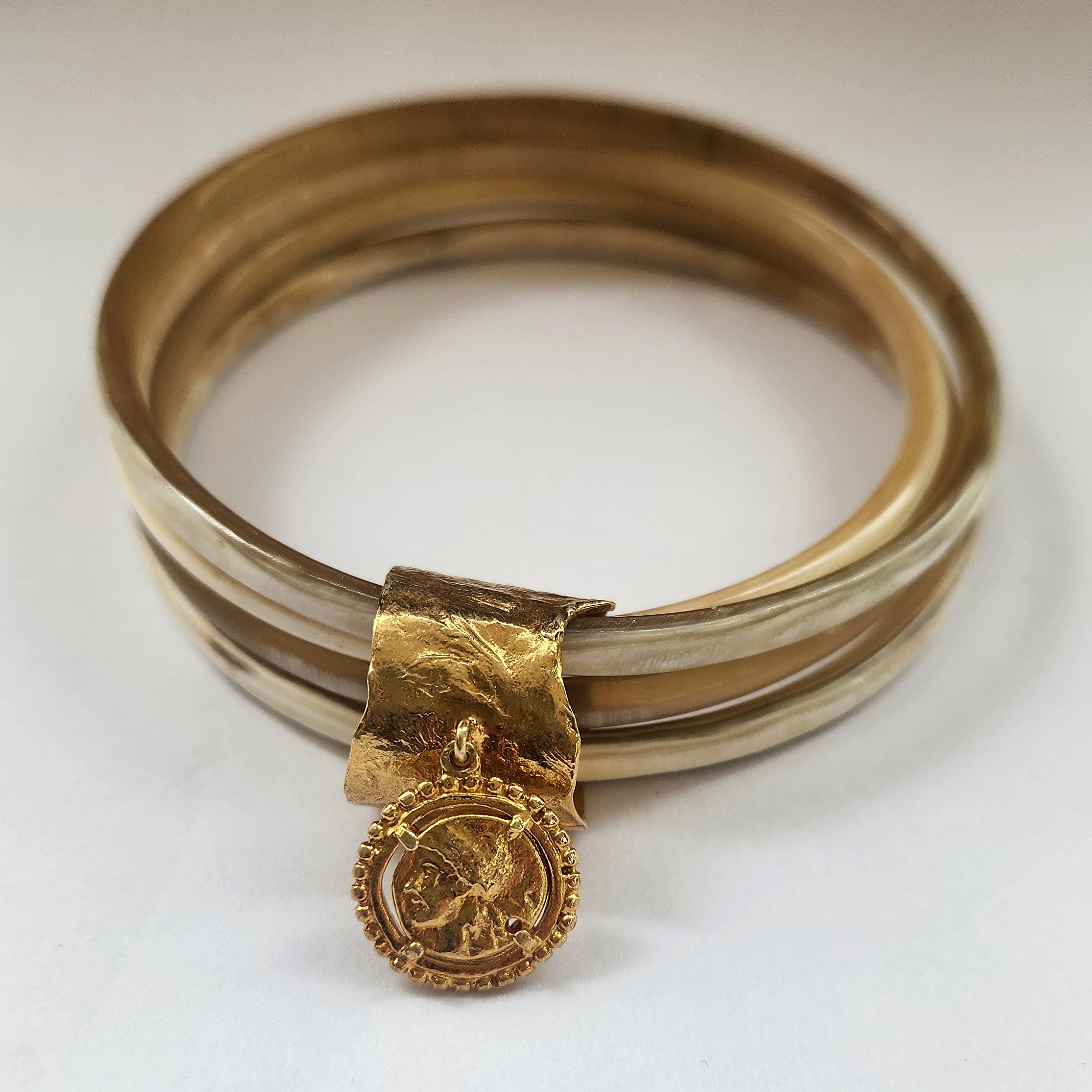 Natural buffalo bangle cluster with gold plated detail