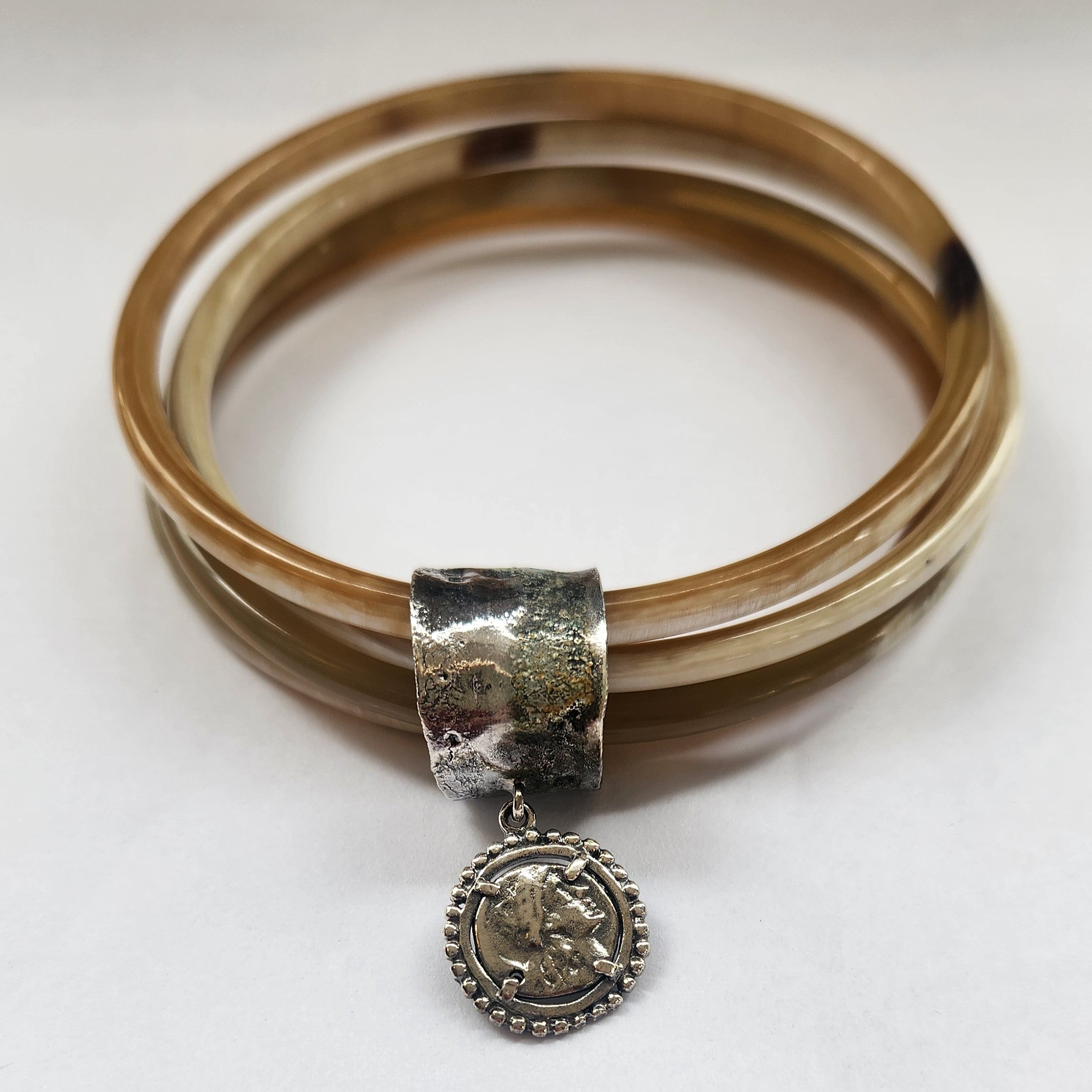 Natural buffalo bangle cluster with silver plated detail