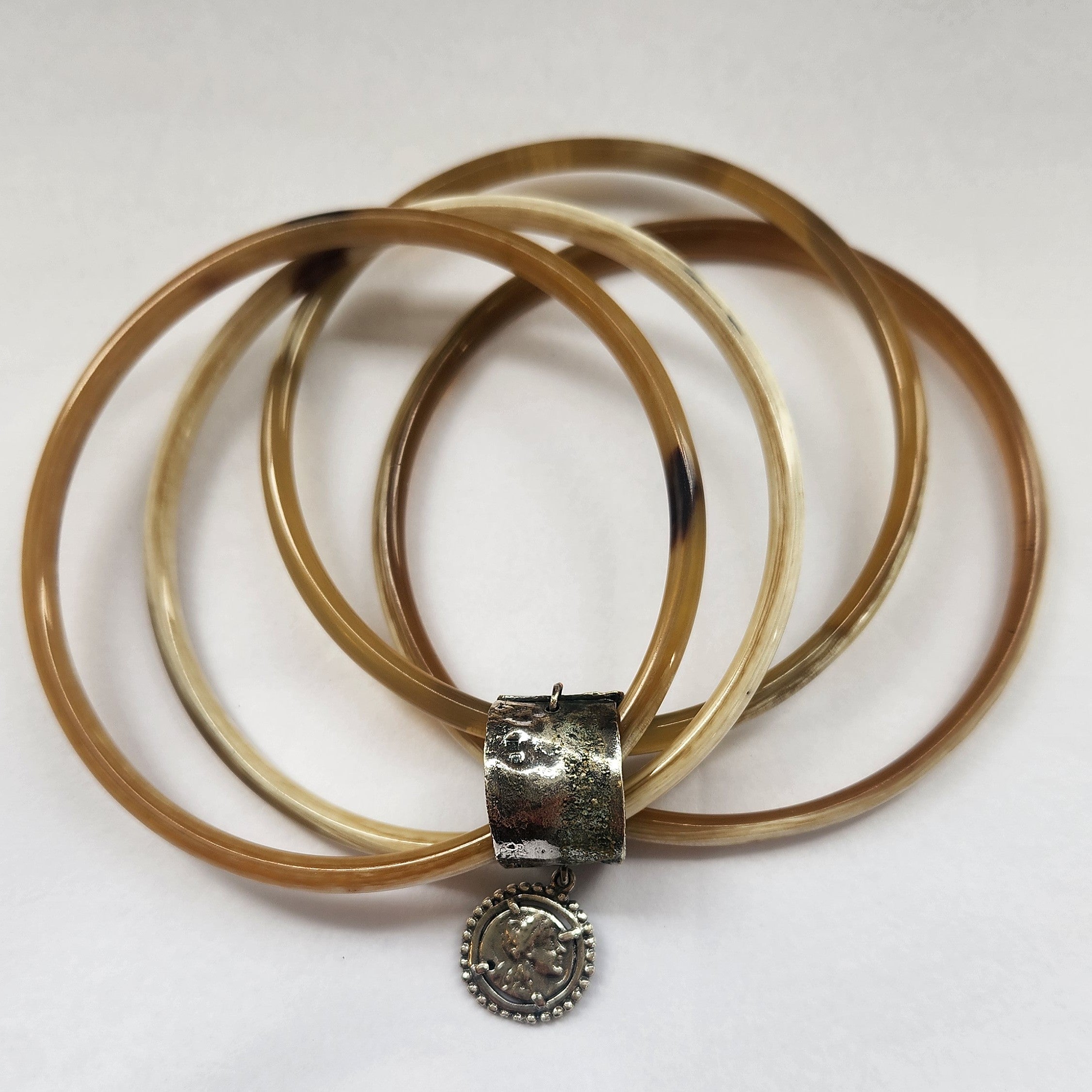 Natural buffalo bangle cluster with silver plated detail