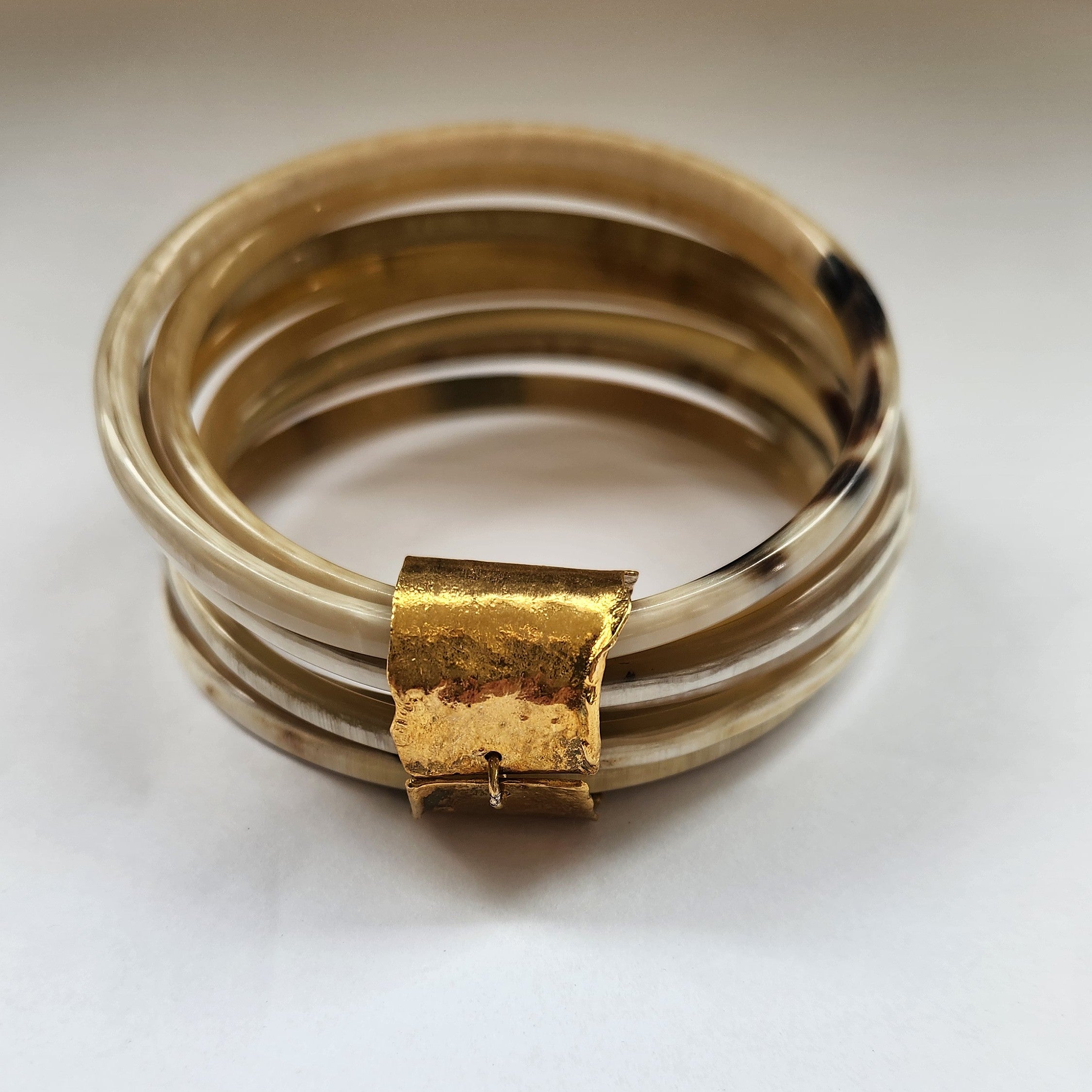 Natural buffalo bangle cluster with gold  plated detail