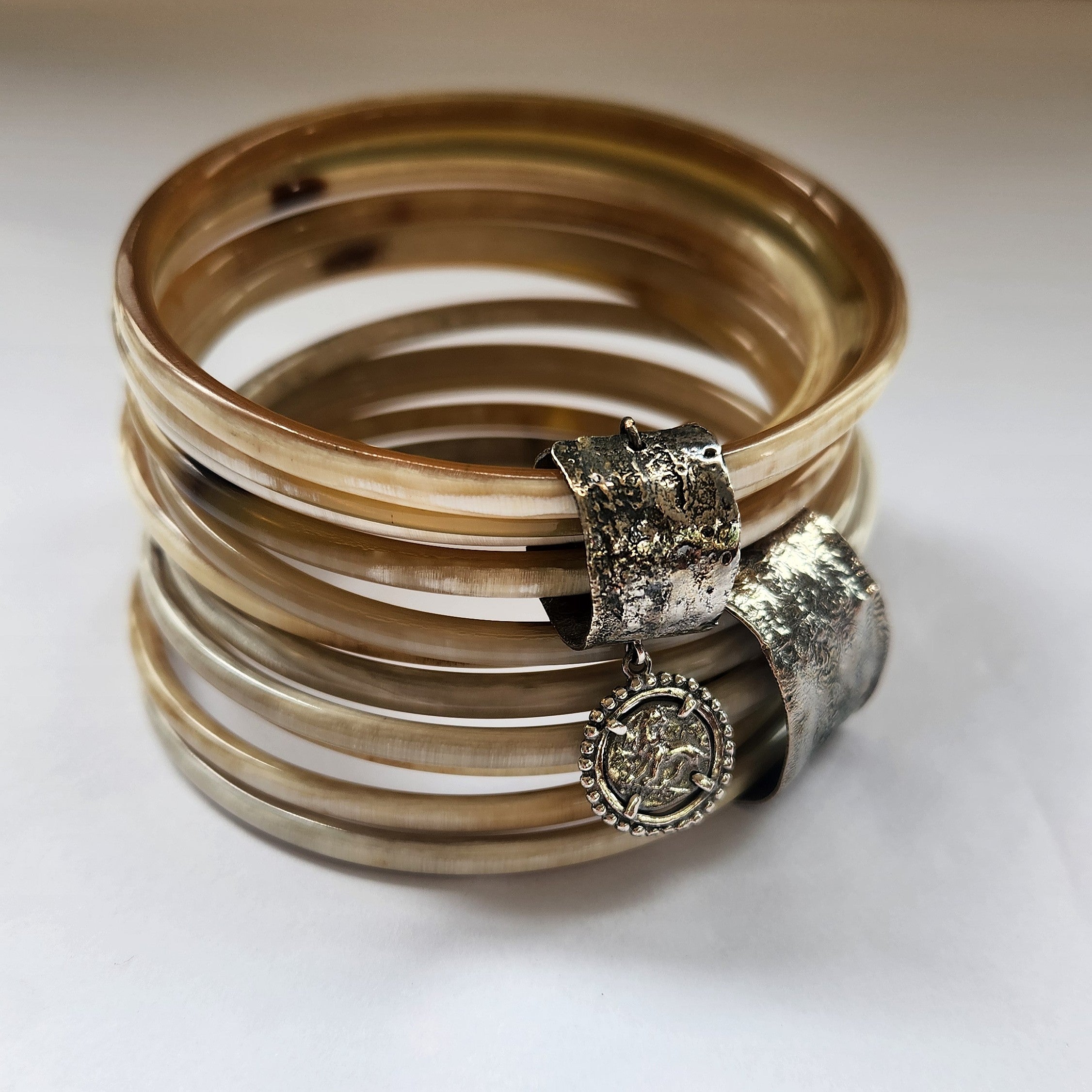 Natural buffalo bangle cluster with silver plated detail