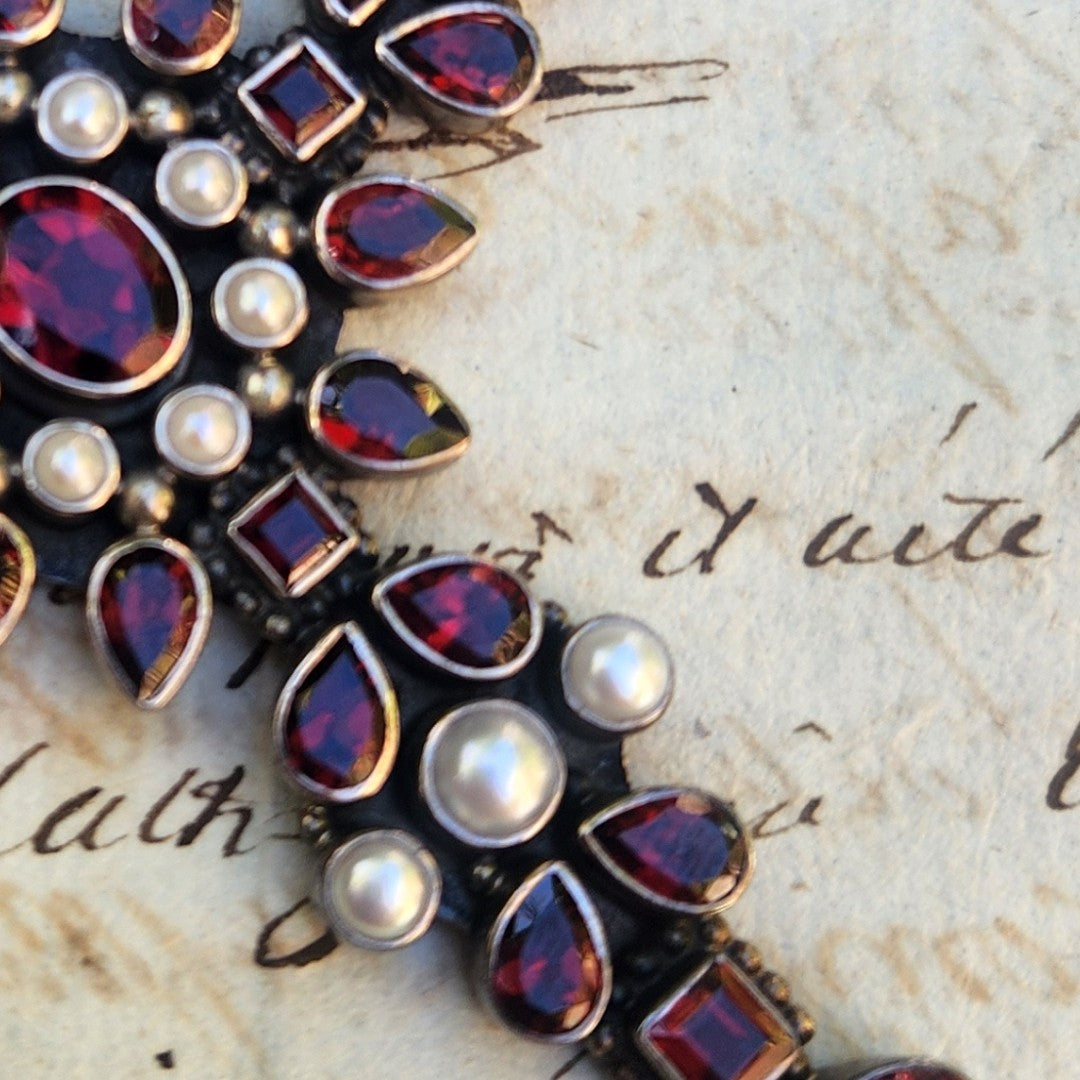 Close up of Vintage Nicky Butler Garnet and Pearl Pendant