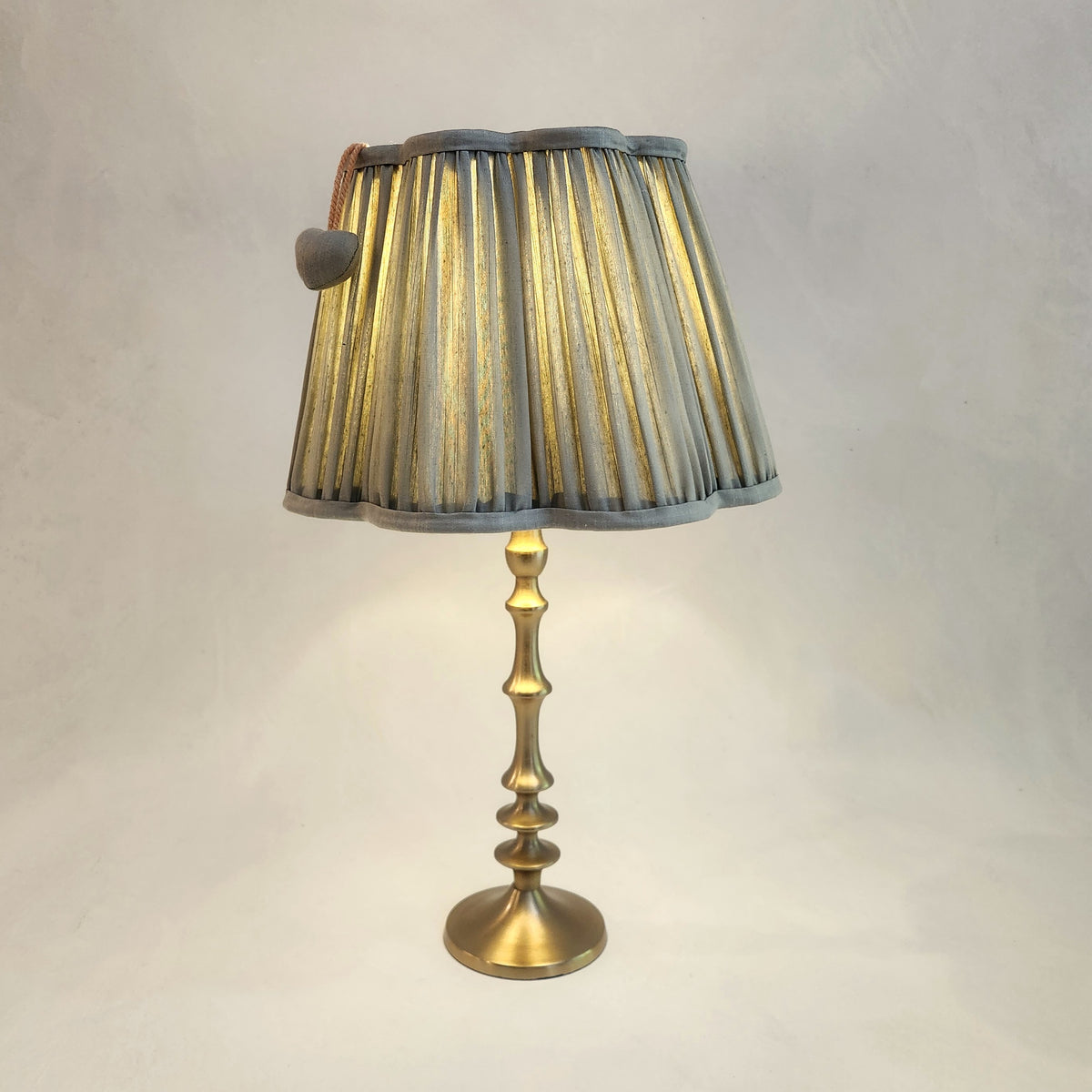 Sage green silk lampshade on brass base
