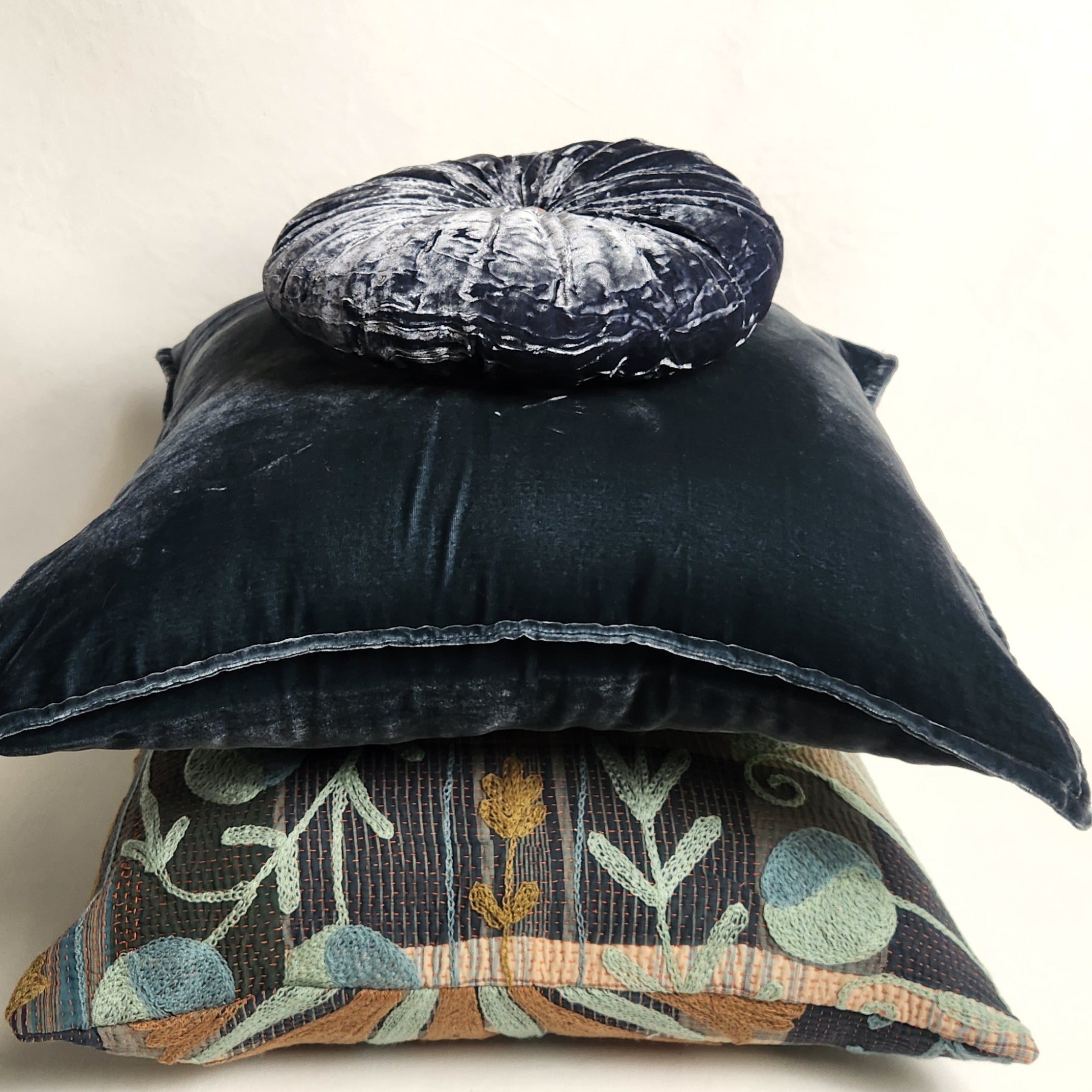 stack of blue cushions