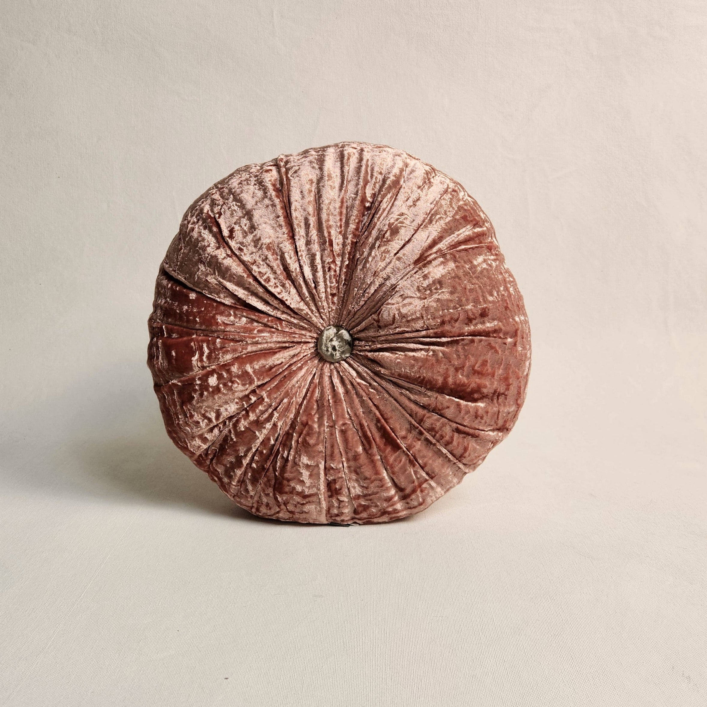 Round pink silk velvet cushion