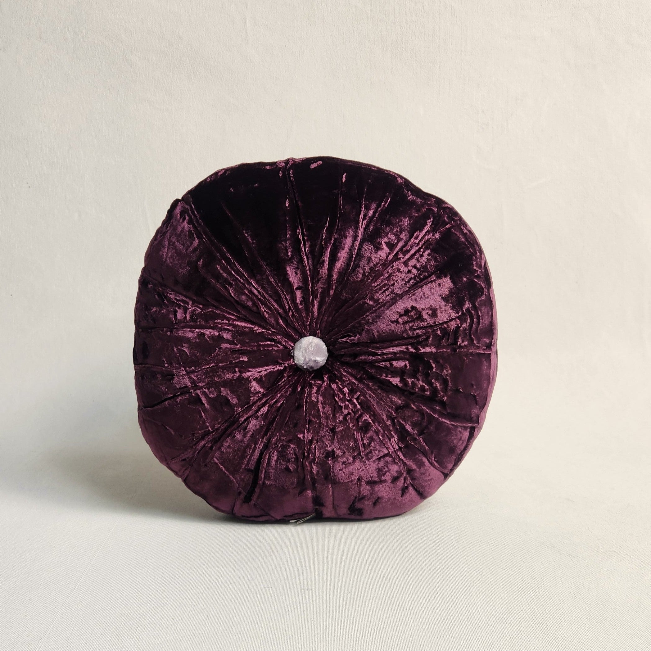 Round purple silk velvet cushion