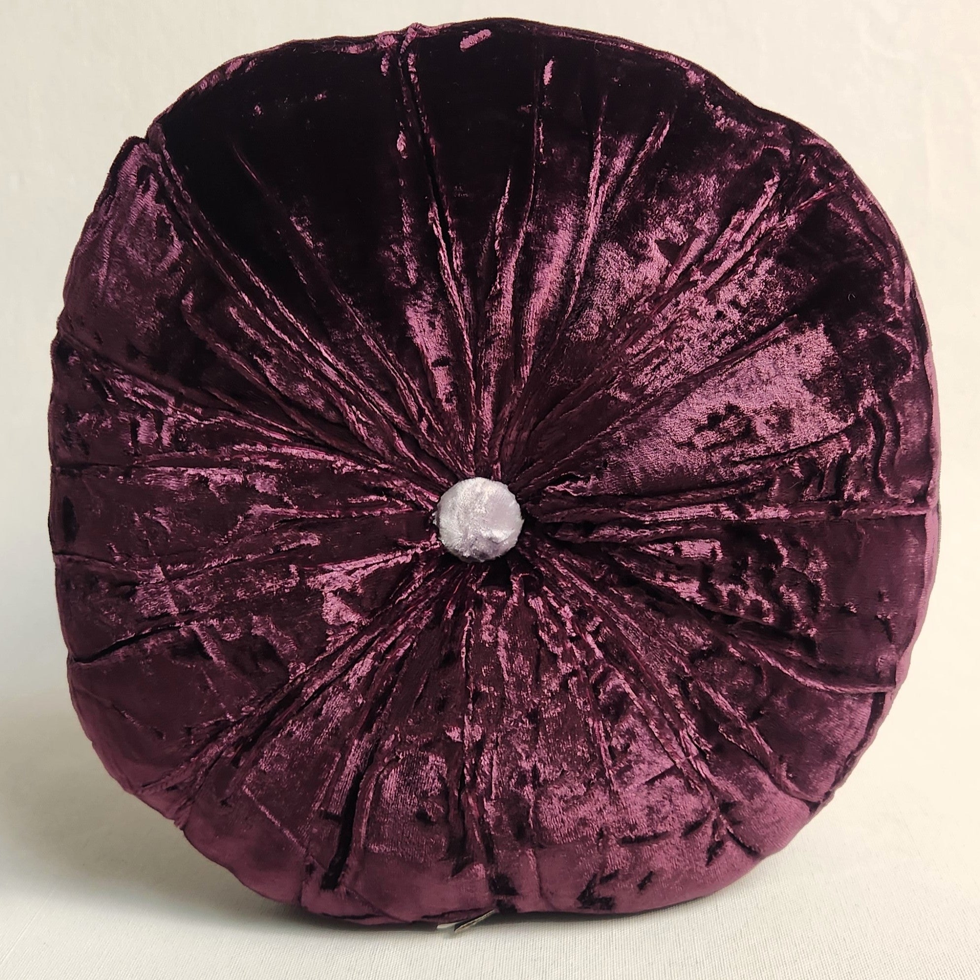 Round purple silk velvet cushion