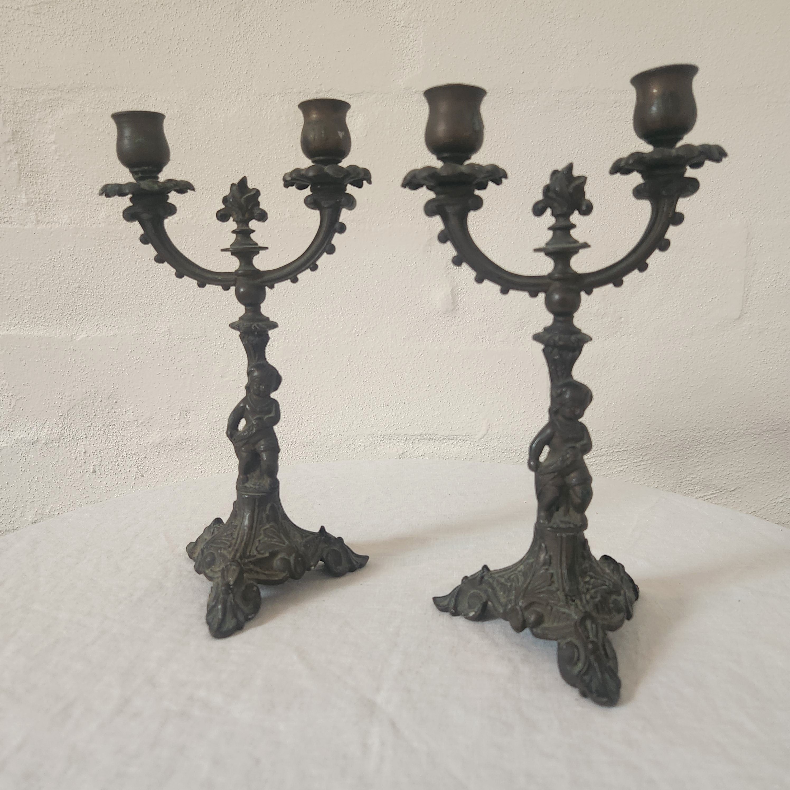 Pair of Cast Iron Metal Putto Candelabras