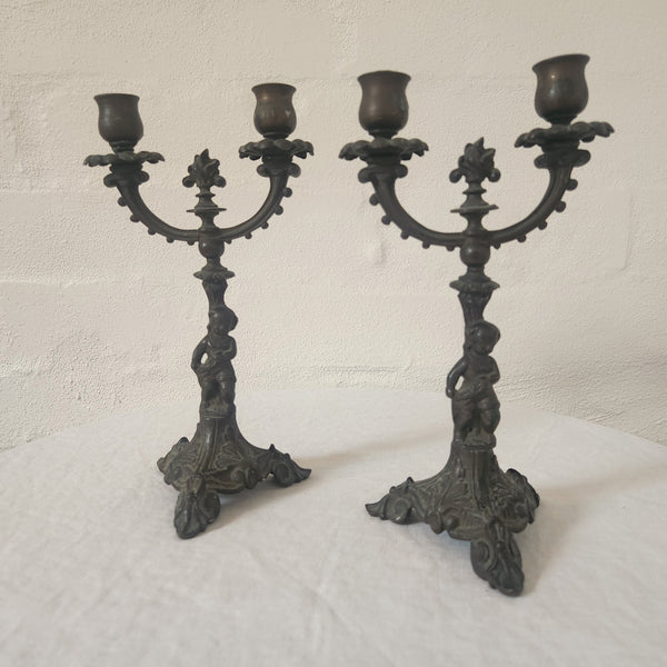 Pair of Cast Iron Metal Putto Candelabras