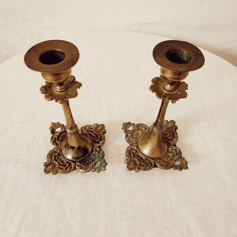 Pair of small brass antique decorative square based candlesticks