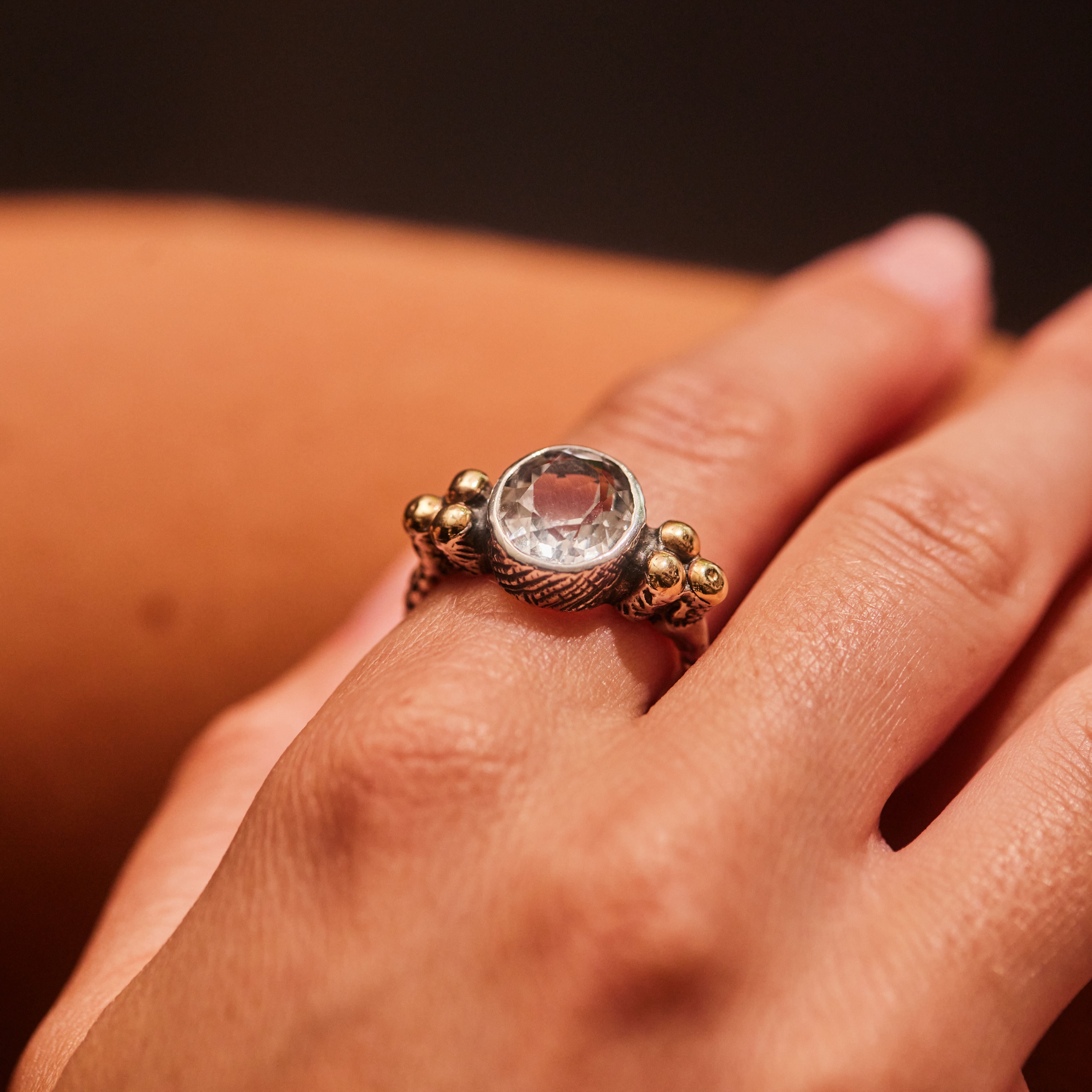 "Luciana" Plaited Silver Ring with Centre rock crystal and 9ct gold clusters.