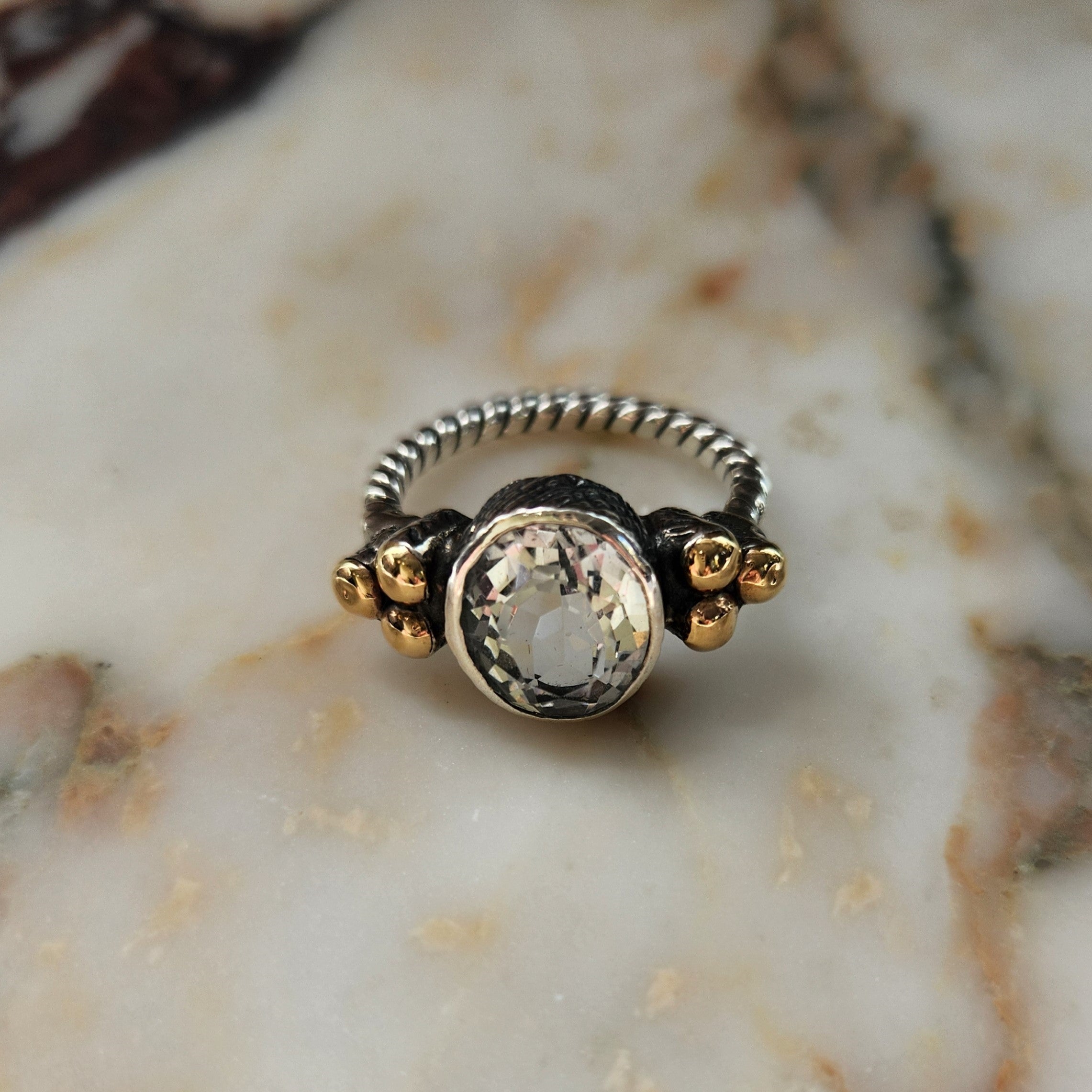 "Luciana" Plaited Silver Ring with Centre rock crystal and 9ct gold clusters.