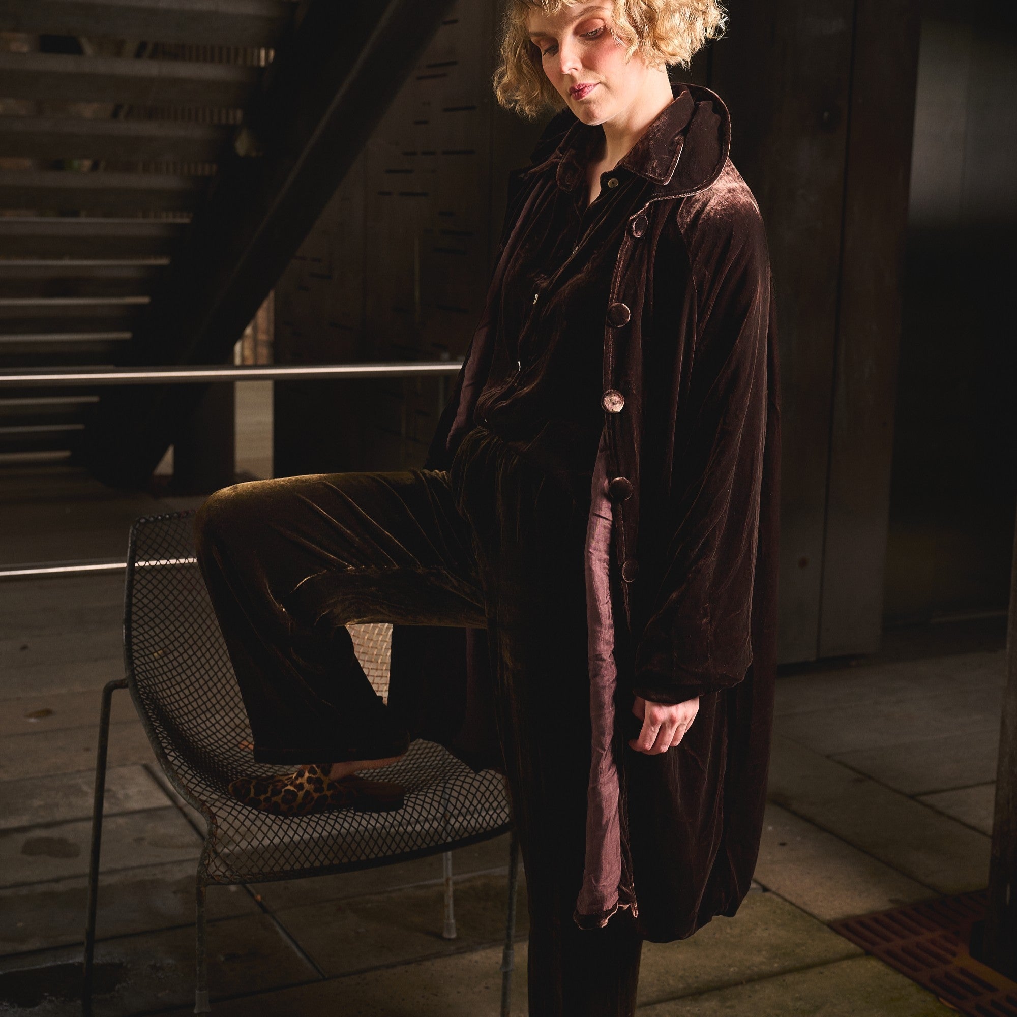 woman in chocolate silk velvet coat