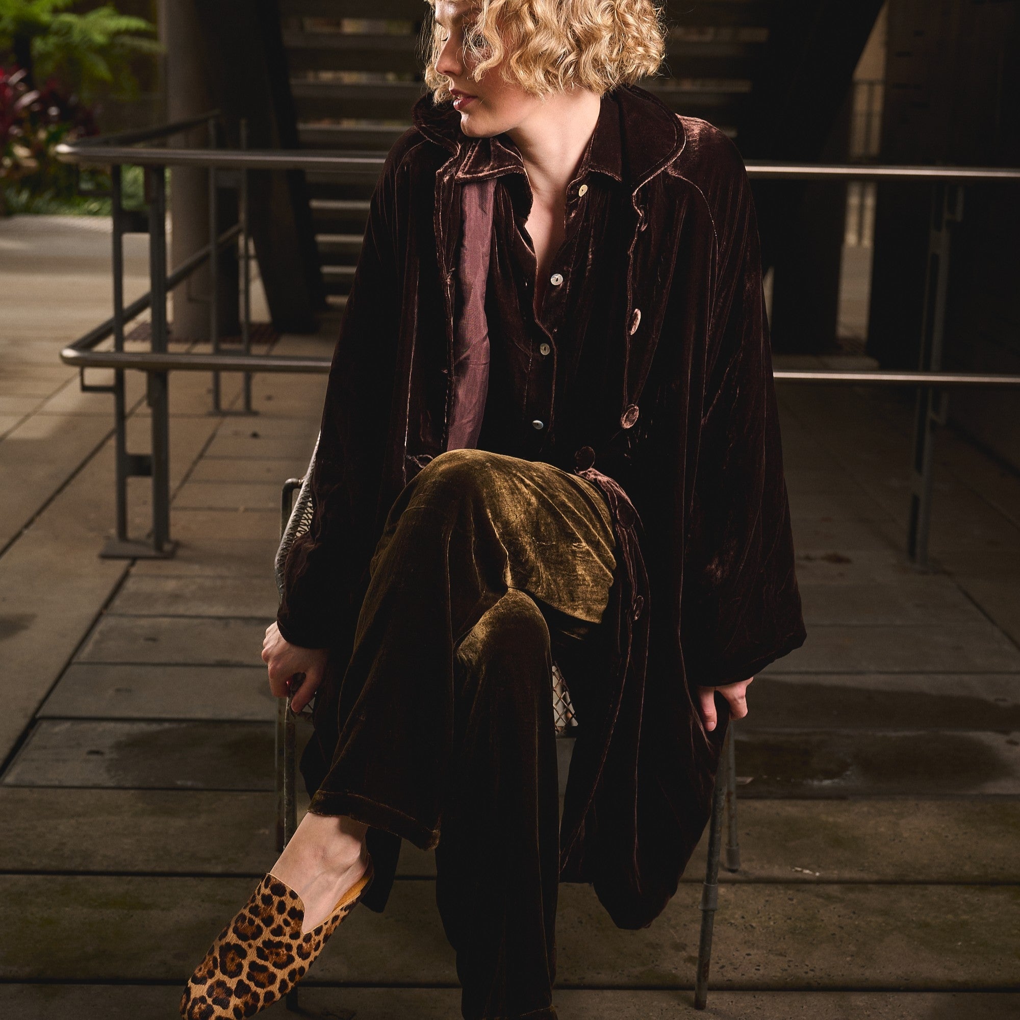 woman in chocolate silk velvet coat