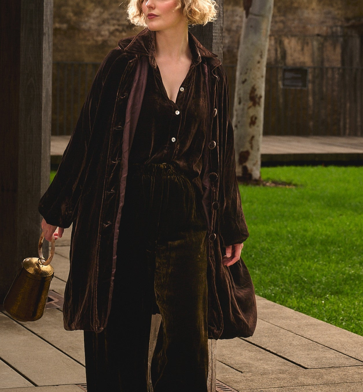 woman in chocolate silk velvet coat