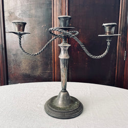 Early metal candelabra with three holders