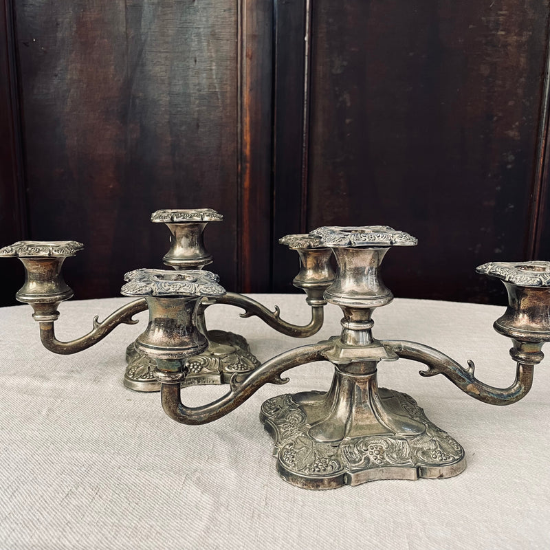 Pair of ornate silver plated three-arm candelabras