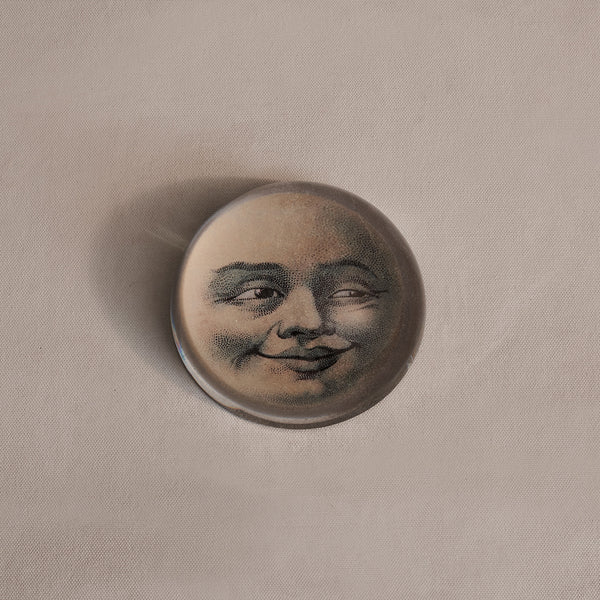 Moon-face paperweight