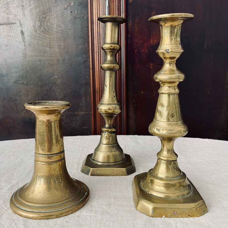Trio of Antique Brass Candlesticks