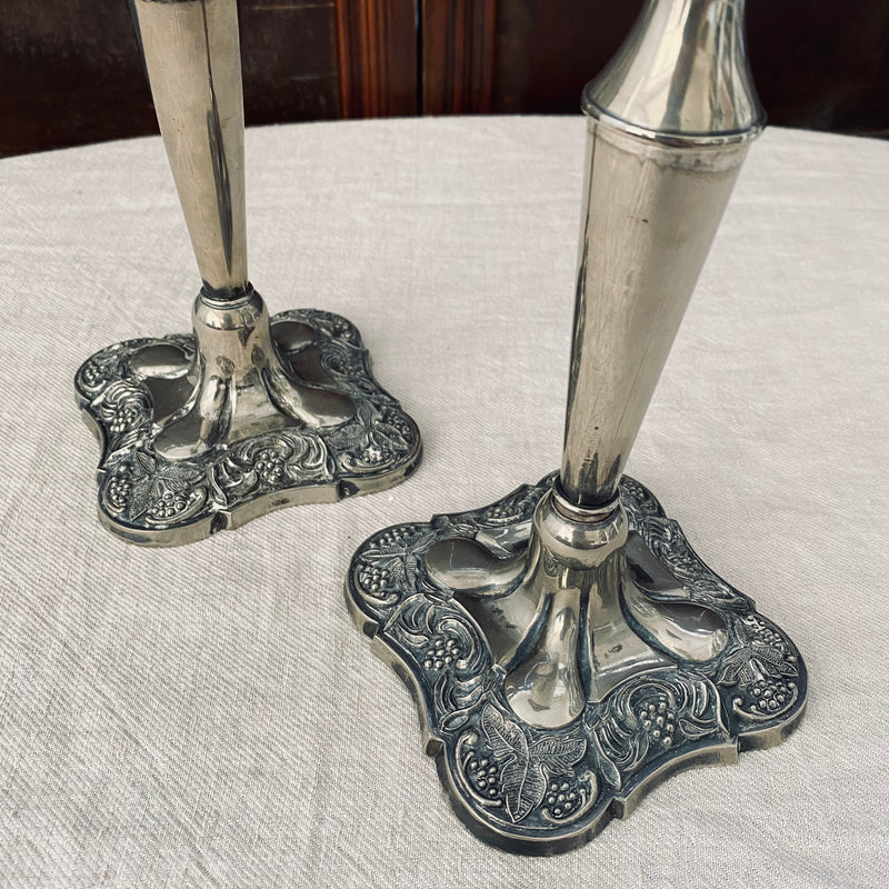 Pair of square-based silver plated candlesticks