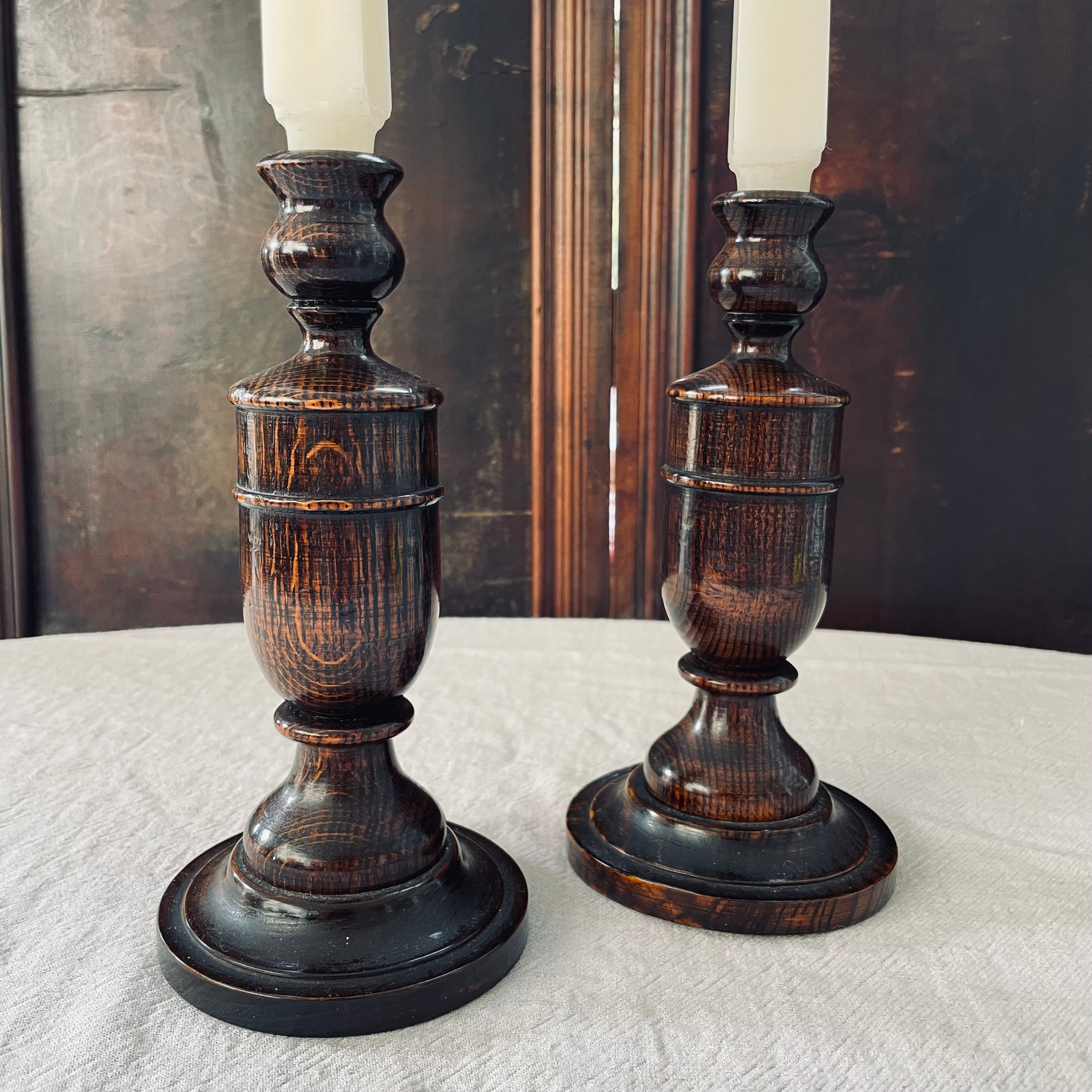 Pair of oak turned candlesticks