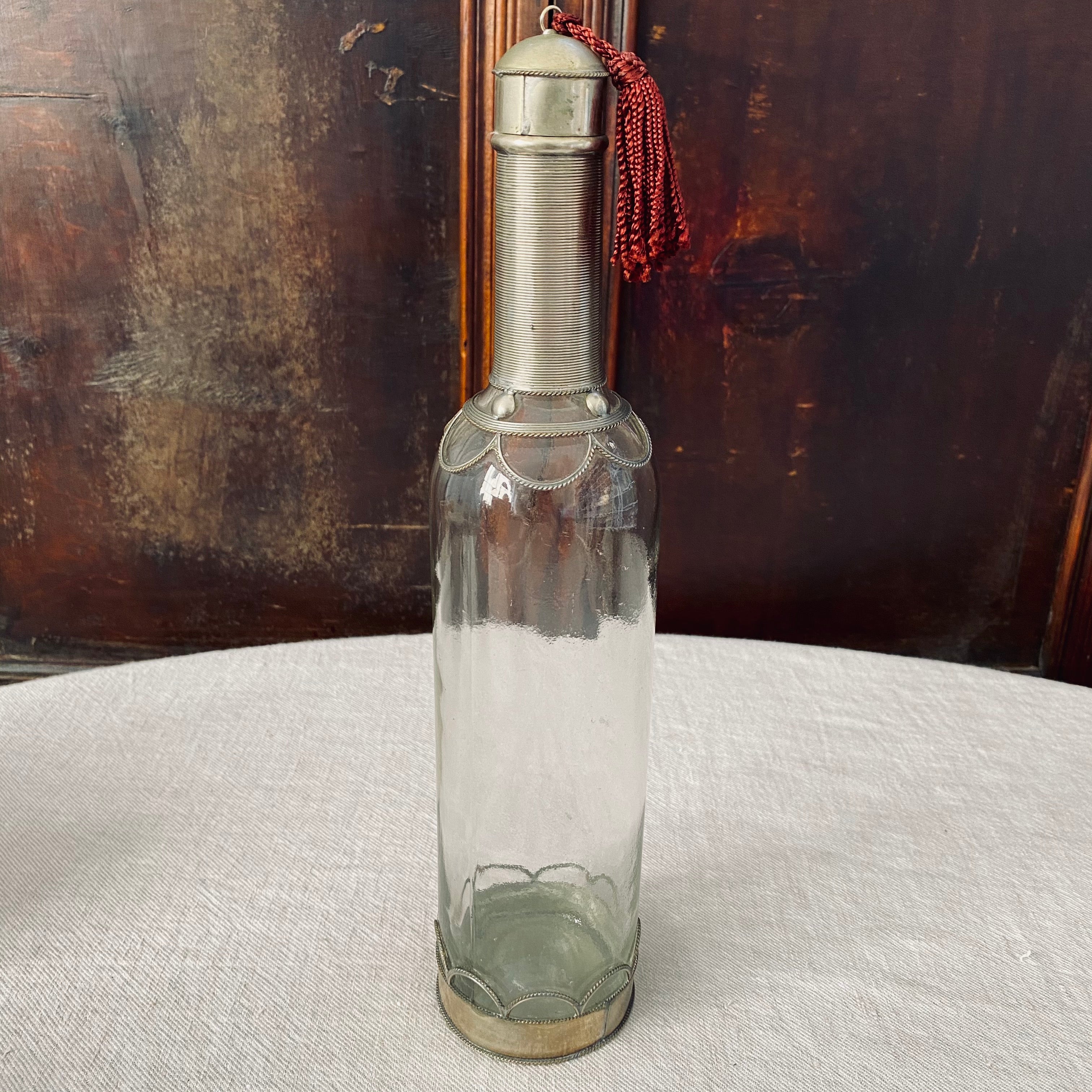 Wirework Mounted Glass Bottle with Burgundy Tassel