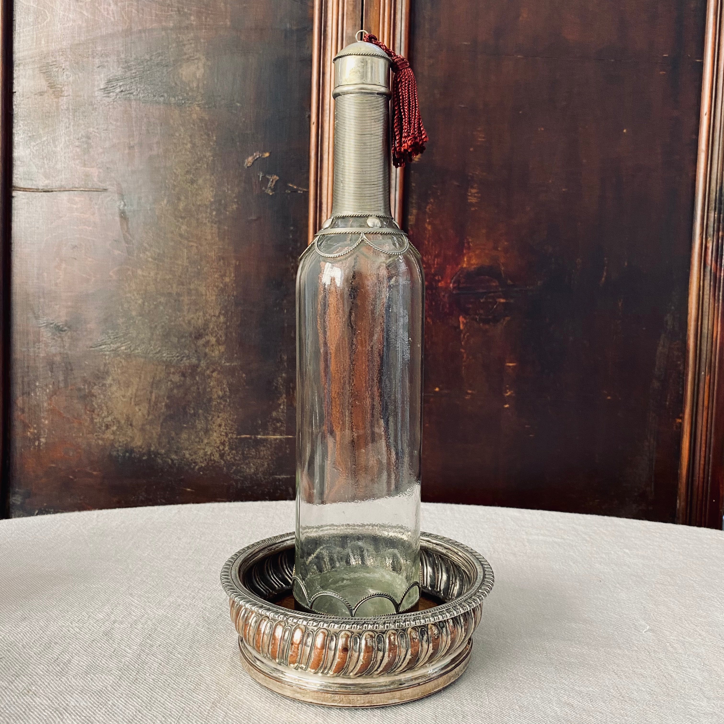 Wirework Mounted Glass Bottle with Burgundy Tassel
